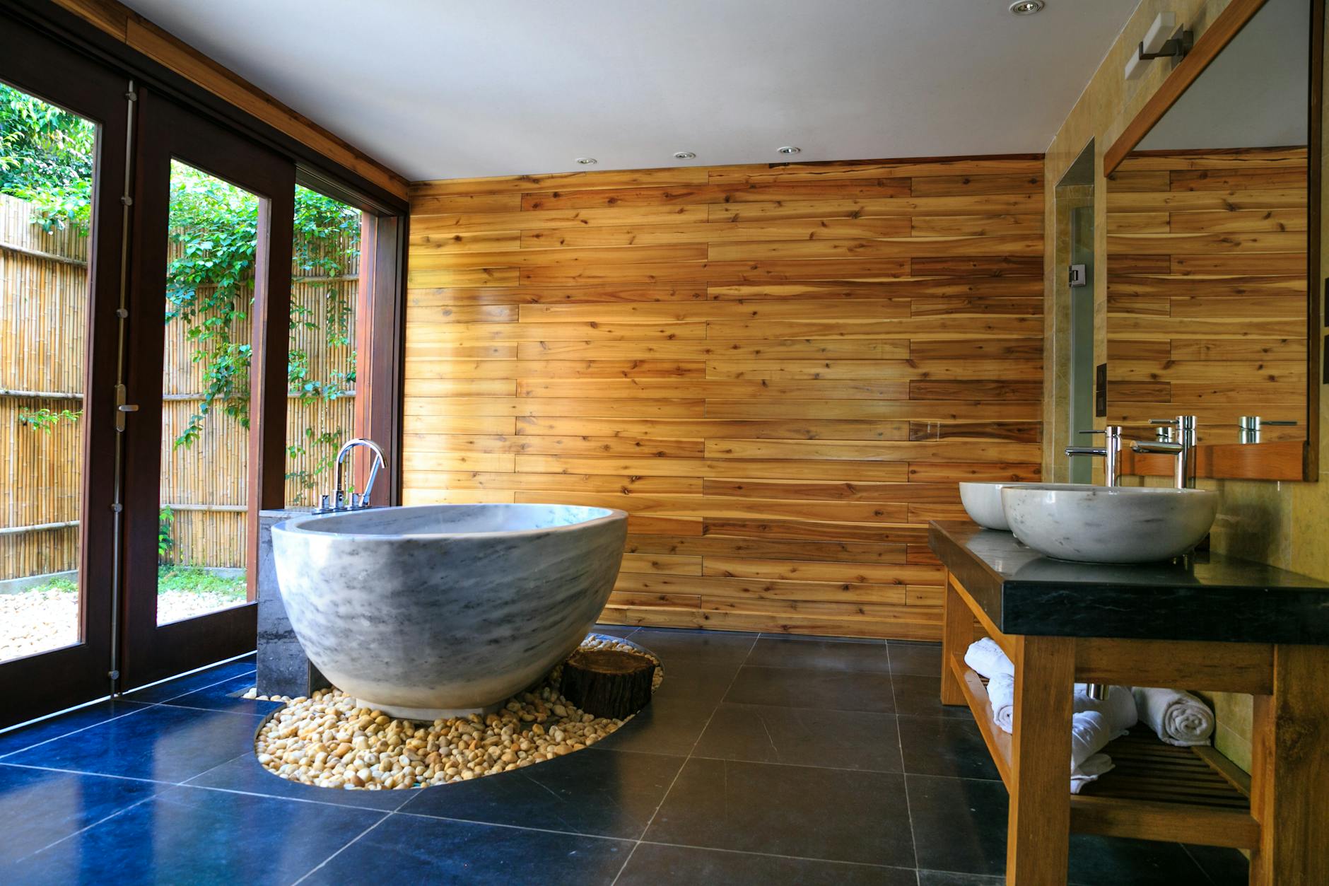 round white and gray ceramic bathtub inside brown room